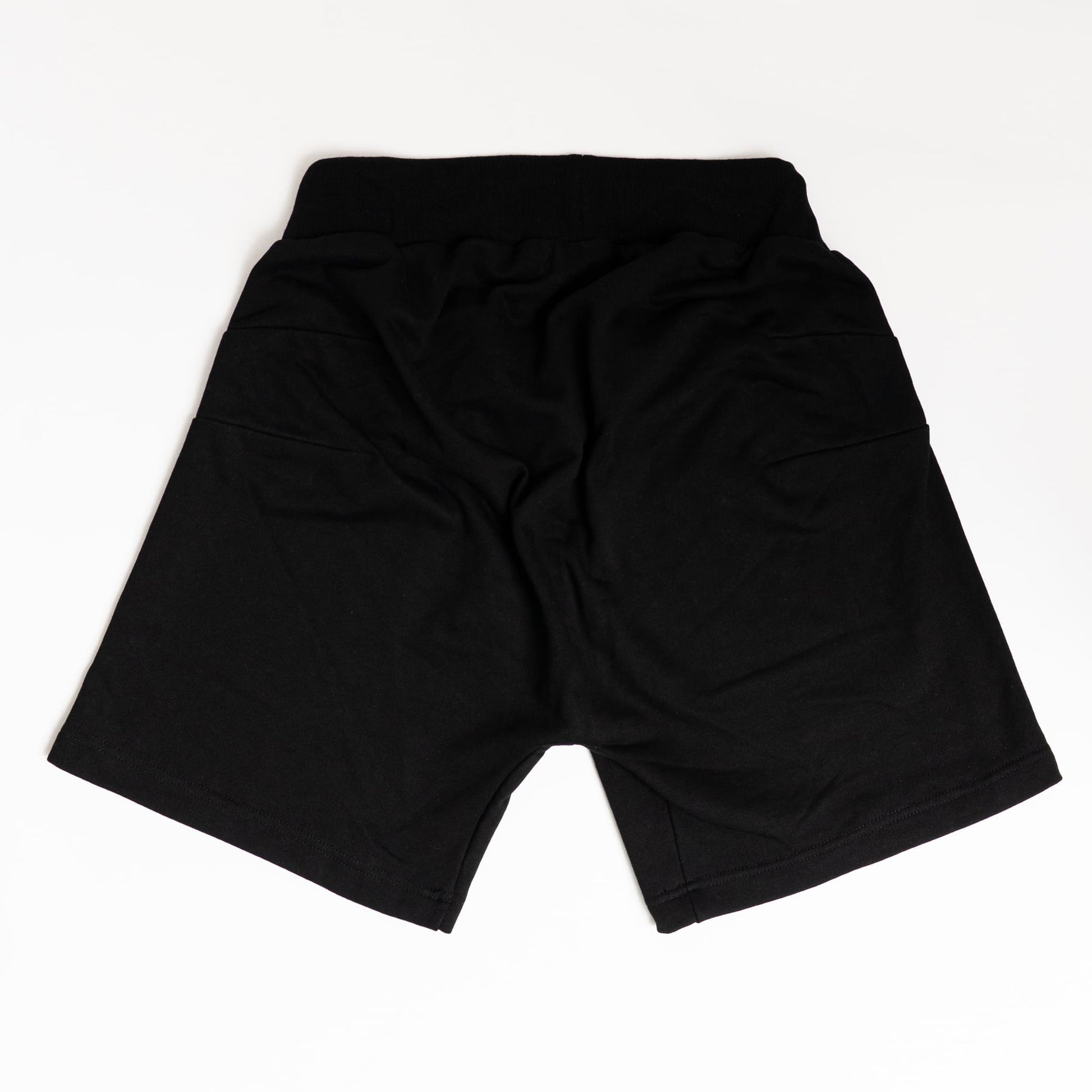 “Back view of adaptive shorts with no seams or pockets, designed to prevent pressure injuries while seated.”